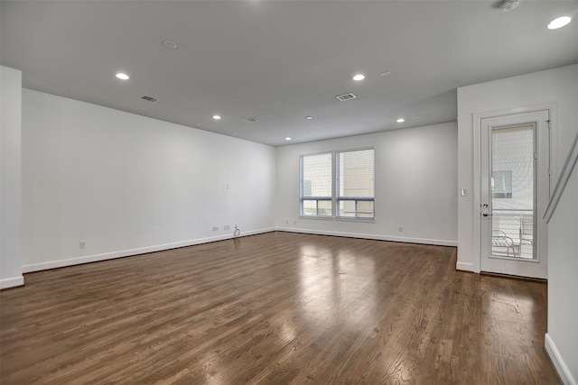 spare room featuring dark hardwood / wood-style floors