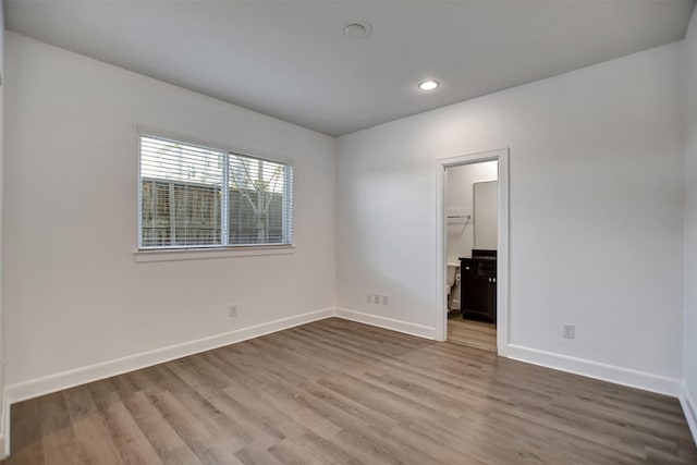 empty room with light hardwood / wood-style floors