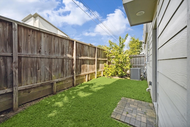 view of yard featuring central air condition unit