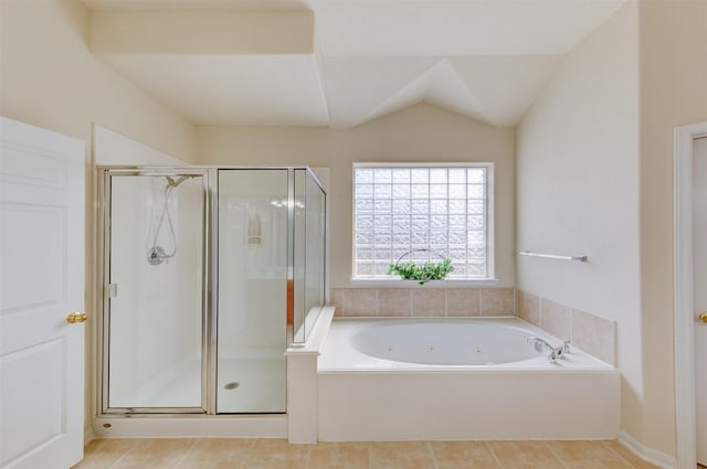 bathroom with separate shower and tub, lofted ceiling, and tile patterned floors