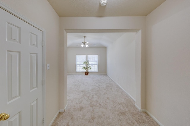 hallway featuring light carpet