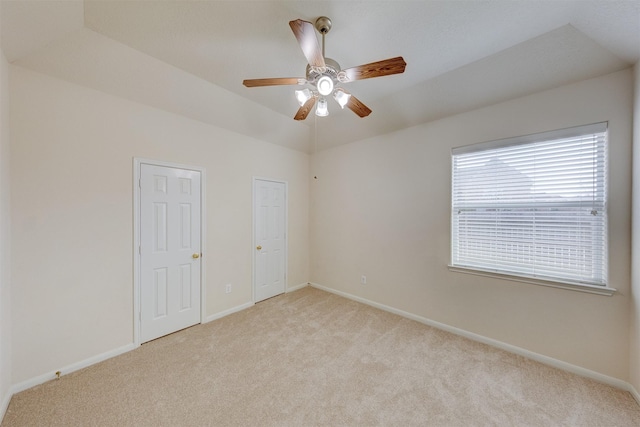 spare room with light carpet and ceiling fan