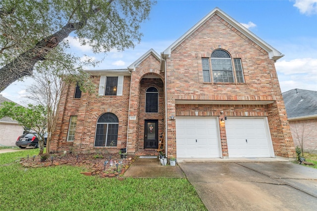 view of property with a garage and a front yard