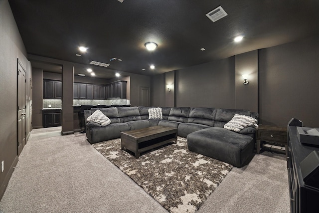 home theater featuring recessed lighting, visible vents, and light carpet