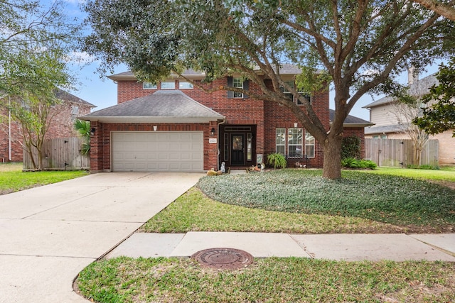 view of front facade with a garage and a front yard