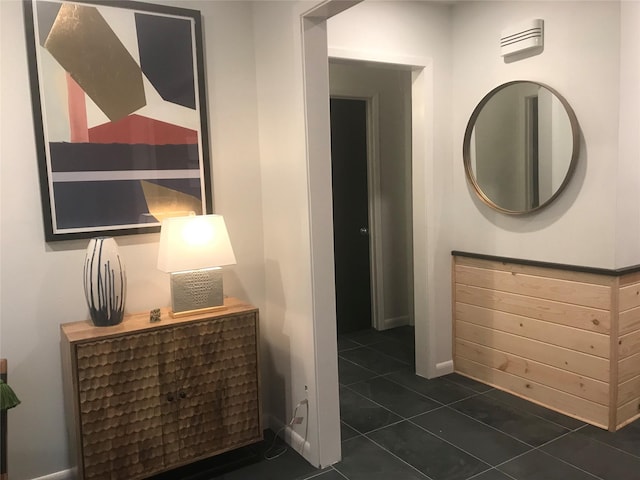 corridor with dark tile patterned floors