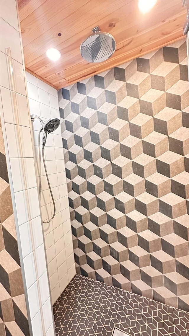 bathroom featuring wood ceiling and tiled shower