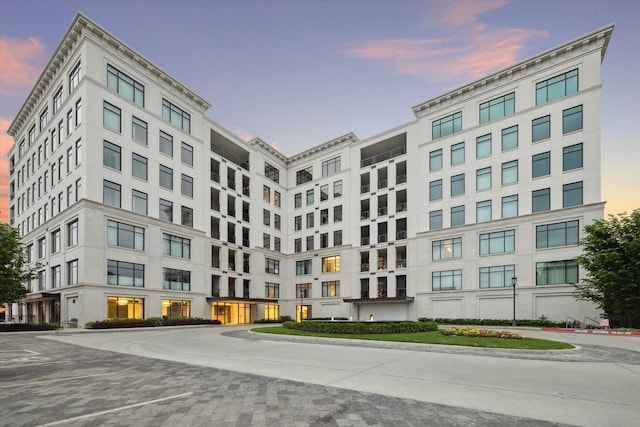 view of outdoor building at dusk