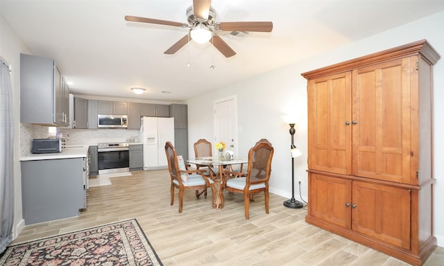 dining space featuring ceiling fan and light hardwood / wood-style flooring