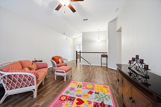 sitting room with lofted ceiling and ceiling fan