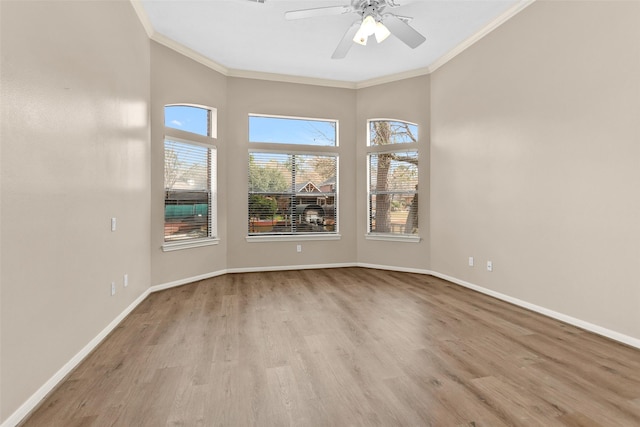 spare room featuring ornamental molding, ceiling fan, and light hardwood / wood-style floors