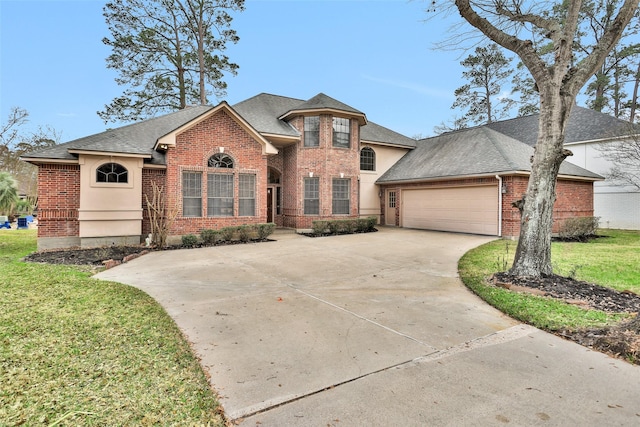 view of front of property featuring a garage and a front yard