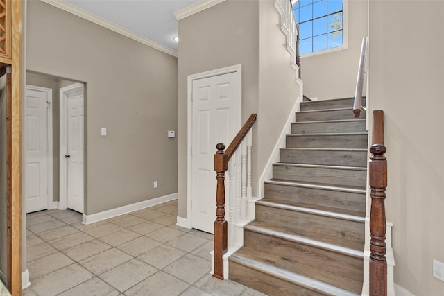 stairway featuring crown molding