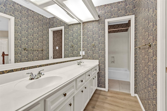 bathroom with hardwood / wood-style flooring and vanity