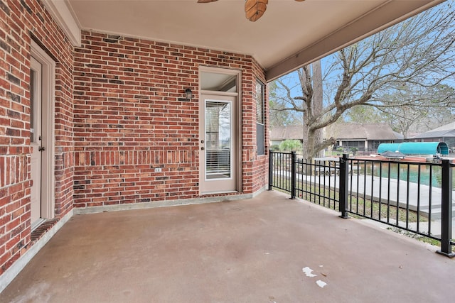 view of patio featuring ceiling fan