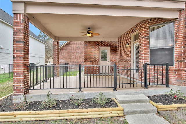 view of patio with ceiling fan and a porch