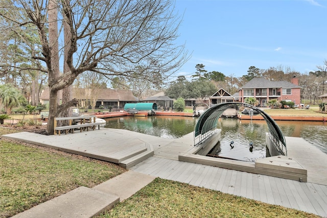 view of dock featuring a gazebo and a water view