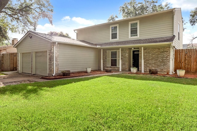 front of property featuring a garage and a front lawn