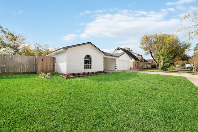 single story home with a garage and a front lawn