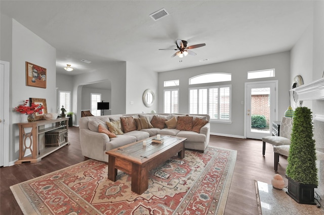 living room with ceiling fan, dark hardwood / wood-style floors, and a healthy amount of sunlight