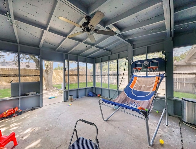 unfurnished sunroom with lofted ceiling and ceiling fan