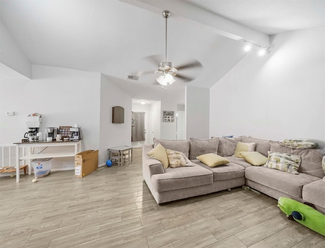 living room with vaulted ceiling with beams, ceiling fan, and light hardwood / wood-style flooring