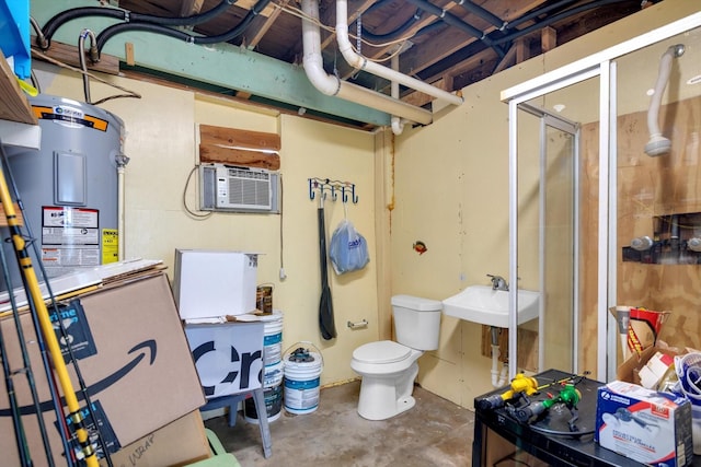 bathroom with sink, concrete floors, an enclosed shower, toilet, and a wall unit AC