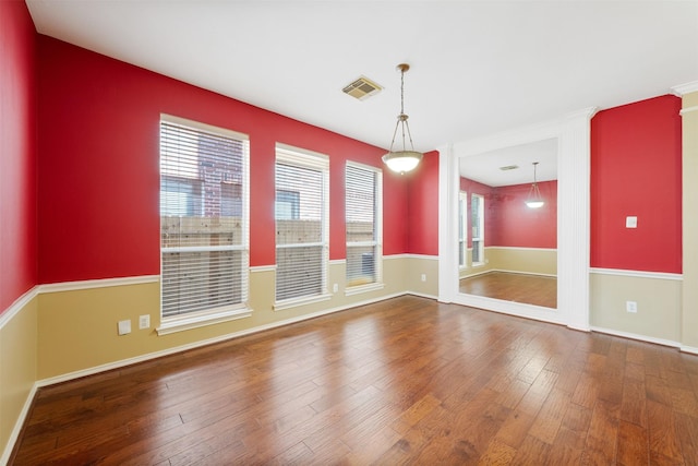 spare room with hardwood / wood-style floors