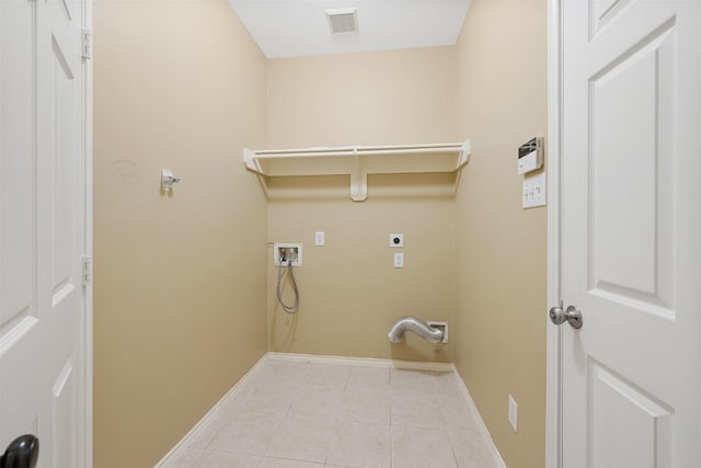 clothes washing area with washer hookup, light tile patterned floors, and hookup for an electric dryer