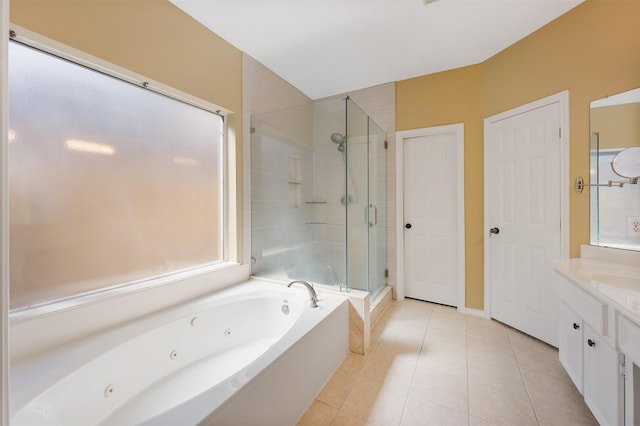 bathroom featuring tile patterned floors, shower with separate bathtub, and vanity