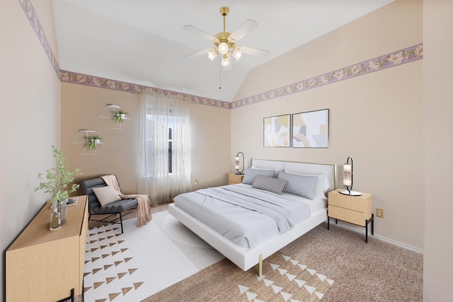 carpeted bedroom featuring vaulted ceiling and ceiling fan