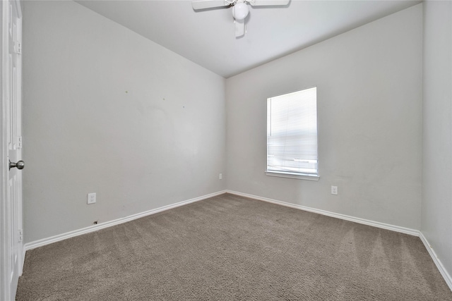 spare room with carpet and ceiling fan