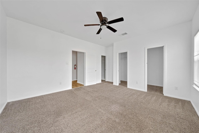 unfurnished bedroom featuring carpet flooring and ceiling fan