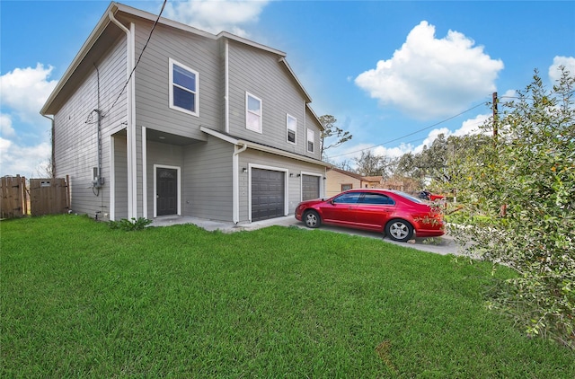 view of property exterior with a garage and a yard