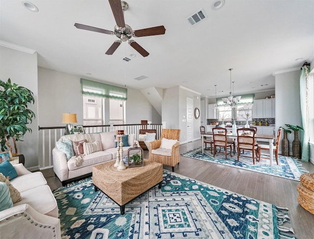 living room featuring crown molding, hardwood / wood-style flooring, and ceiling fan