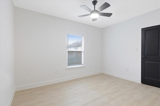 6609 Ave Q, Houston, TX 77011 - empty room featuring light wood finished floors, a ceiling fan, and baseboards