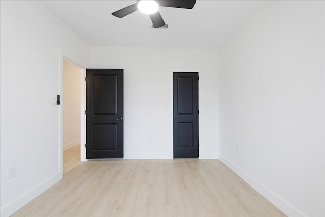 6609 Ave Q, Houston, TX 77011 - unfurnished bedroom with a ceiling fan, baseboards, and wood finished floors