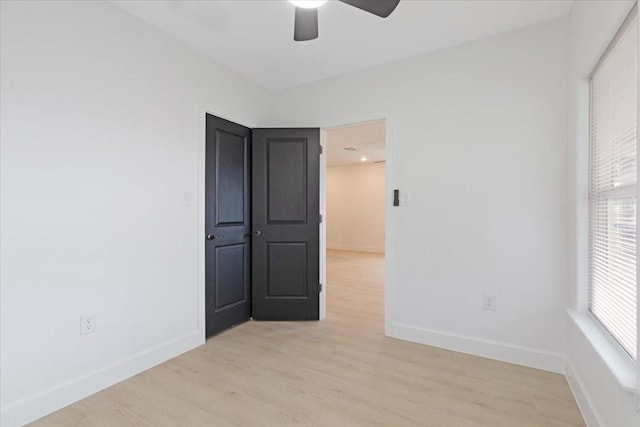 6609 Ave Q, Houston, TX 77011 - empty room featuring a ceiling fan, light wood-type flooring, and baseboards