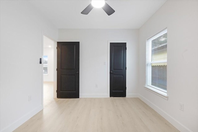 6609 Ave Q, Houston, TX 77011 - unfurnished bedroom featuring a ceiling fan, baseboards, and wood finished floors