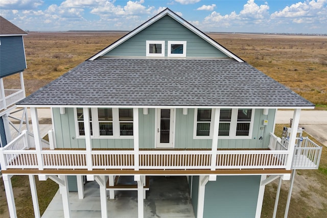 back of house with a balcony