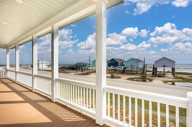 wooden terrace with a water view