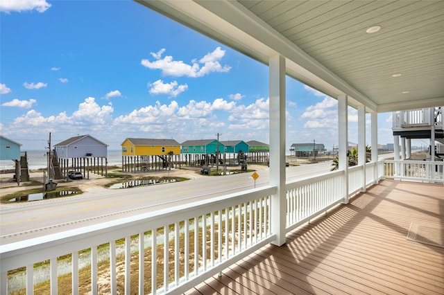 wooden terrace with a water view