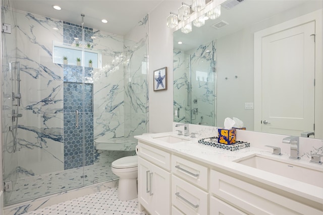 bathroom with walk in shower, vanity, and toilet