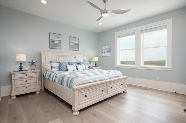 bedroom featuring ceiling fan and light hardwood / wood-style flooring