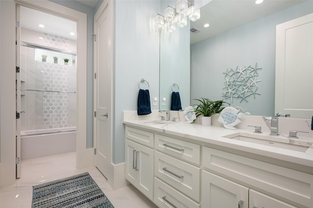 bathroom featuring vanity, a notable chandelier, and bath / shower combo with glass door