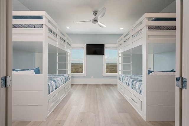 bedroom with ceiling fan and light wood-type flooring