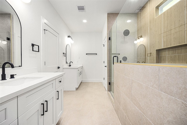 bathroom with vanity and an enclosed shower