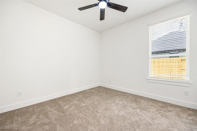 empty room featuring carpet and ceiling fan