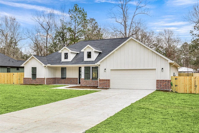 view of front facade with a garage and a front lawn