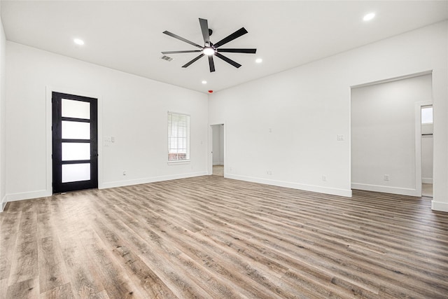 unfurnished room featuring ceiling fan and hardwood / wood-style floors